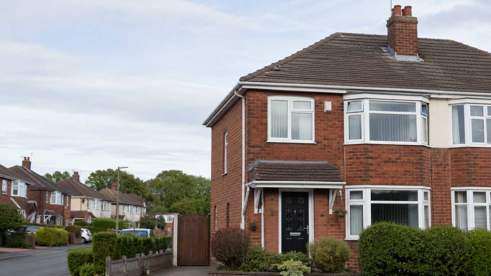 Brick gable and pitched roof typical of older northern housing